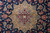 Close-up of the beige central medallion with red, sky blue and navy lotus blossoms