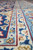 Ivory guard stripe and burgundy outline running along the length of this 9x13 rug