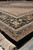 Low angle corner view showing thick black border, ivory spandrel field and clean selvage edge