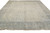 10'3" x 13'6" hand-knotted Oushak area rug photographed at an angle with ivory fringe