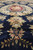 10 x 14 navy rug close to the floor showing silk highlighted sprays and wool pile