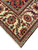 Ivory outer border with red rosettes and teal serrated leaves framing this oversize Persian rug