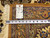 Back of the hand-knotted rug showing original tag reading rug number 6856 beside measuring tape