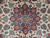 Close-up of red star medallion with blue palmettes, sage rosettes and low clipped wool pile