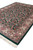 Corner angle of 8'8" x 11'8" green Jaipur rug with wide ivory floral border