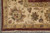 Corner detail with ivory border, gold outer stripe, red petal accents and cream cotton fringe