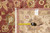 Tape measure and hand woven Oriental rug tag confirming the 10 x 14 dimensions