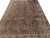 8x11 Persian Bijar rug photographed at an angle, ivory palmette border framing the floral field