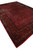 10'8" x 16' antique Persian Kashan rug angled view with wide navy border and camel guards