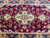 Width of the 2'9" runner showing medallion repeat, ivory guard stripes and navy floral border