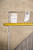 Reverse of 10'2" x 13'9" Pakistani rug with original workshop tags and tape measure