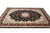 9x12 hand-knotted Oriental rug angled view showing burgundy border, sage spandrels and ivory guard stripes