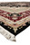Low angle corner view of Tabriz design rug with plush fringe and floral medallion border