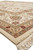 Low angle corner shot of ivory rug edge, plush pile and hand-tied ivory fringe