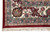 Ivory main border corner with black palmette, crimson vine and pastel blue guard stripes detail
