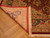Folded corner of Qum silk rug revealing fine knotting, red selvage and full fringe