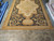 12 x 18 flat weave rug viewed from one end with medallion and black field visible