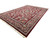 Perspective view showing the 18 foot length and deep wine red ground of this Indian rug