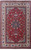 Red Persian Isfahan rug with navy star medallion and ivory paisley border, oversize 11x17