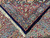 Folded corner detail of 11'4 x 16'10 Persian rug showing borders, fringe and navy selvage