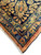 Navy border corner with gold palmettes, rust accents and clean ivory fringe on this 1930s Sarouk