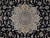 Close-up of ivory star medallion with silk highlighted palmettes and arabesques on midnight navy field
