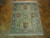 8'3" x 10'2" Chinese silk rug displayed on parquet floor showing full panel layout and borders