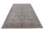 Angled studio photograph showing the soft grey ground and olive brown palmette border in full