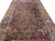 Angled floor view of the 1930s Sarouk palace size rug showing detached floral bouquets throughout