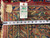 Original back tag reading rug number 6908, size 10.1 x 17.6, beside a tape measure