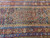 Overhead section of the 6x17 Persian runner showing medallion, navy field and layered borders