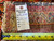 Back tag reading rug number PIX-2348 and size 6.4 x 17.2 beside tape measure