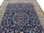 10' x 13'4" Persian Sarouk area rug shown from one corner with ivory floral border