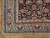 Corner detail with rose main border, teal boteh motifs, ivory guard stripes and thick pile