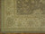 Corner detail with cream border, vinework, small rust outlines and hand-finished selvage on wool pile