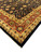 Corner detail of deep red main border with gold palmettes and black outer guard band