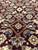 Macro view of the Herati fish pattern with yellow rosettes, olive leaves and blue accents