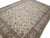 Side angle of the hand-knotted wool and silk rug revealing soft sheen across the ivory pile