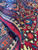 Pile folded back to show dense hand-knotted wool, saturated dyes and low even nap