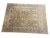 15'4" x 20'10" oversize Oriental rug photographed at an angle showing ivory main border and sage field