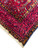 Ivory fringe beside the corner of the burgundy border carrying navy Persian verse cartouches