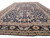 Navy all-over floral field receding down the length of this oversize hand-knotted wool rug