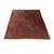8'2" x 11'8" Persian Sarouk rug displayed at an angle showing rich red field and new fringes