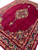 Oversized 10x14 Persian rug photographed at an angle, medallion and flowering borders on wine red ground