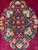 Central floral medallion close-up with salmon roses, cream daisies, blue leaves and an 8 petal rosette