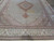 Wide angle of 8 x 11 Persian rug showing medallion, pendant and full green main border