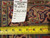Back tag reading rug number 6501, size 13.2 x 19.9, with tape measure on weave