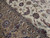 Close-up of blue palmettes, camel border and ivory field showing fine wool and silk knotting