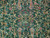 Close view of golden vines, leopards and rose blossoms scattered across the emerald green wool field