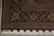 Corner detail with black floral border, fine guard stripes and hand-tied ivory cotton fringe
